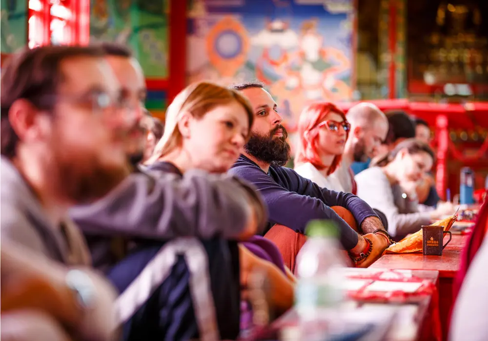 People receiving teachings on dharma.